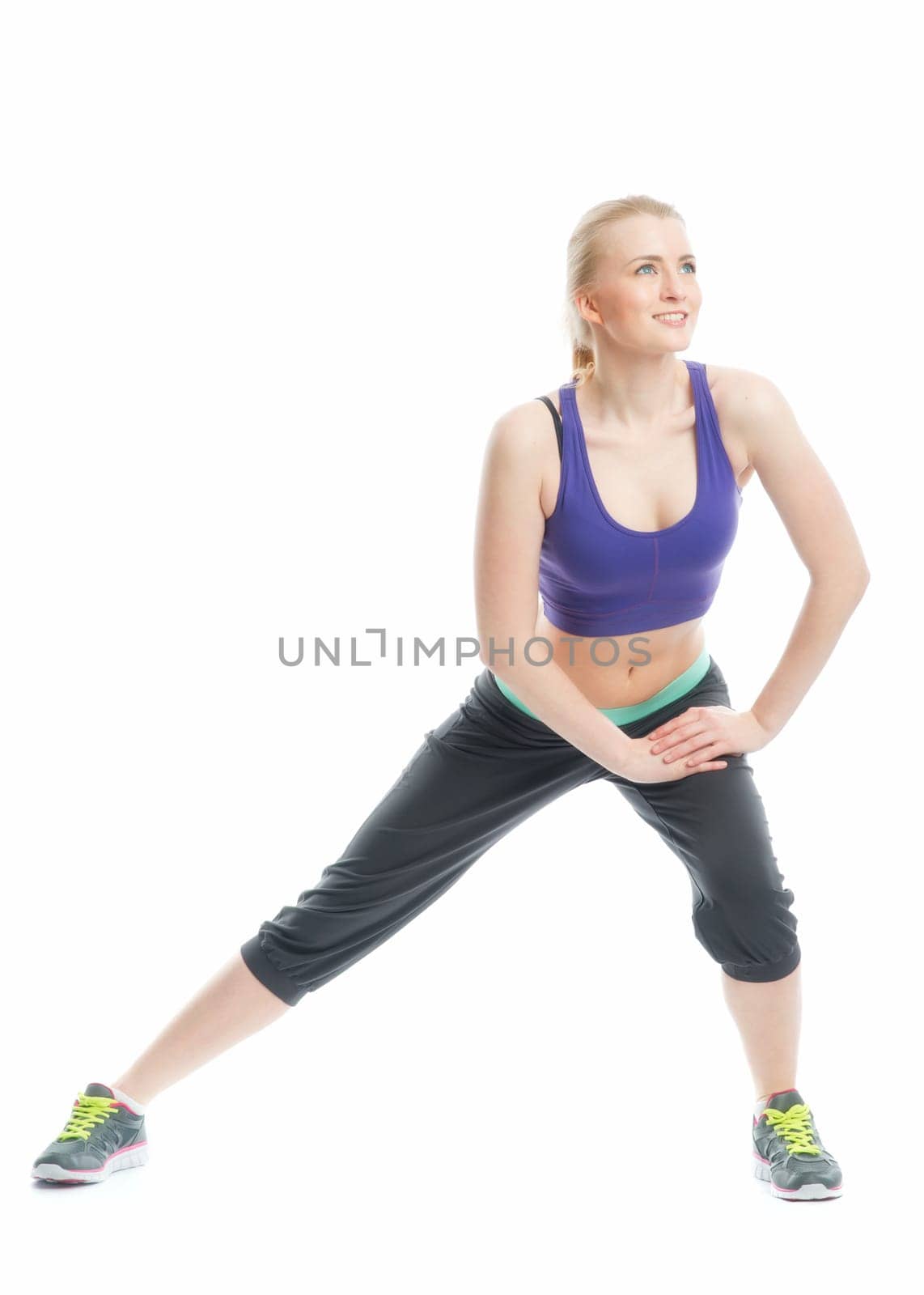 Blonde girl does gymnastics