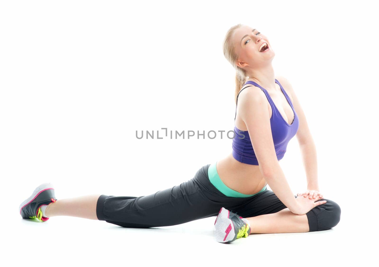 Blonde girl does gymnastics