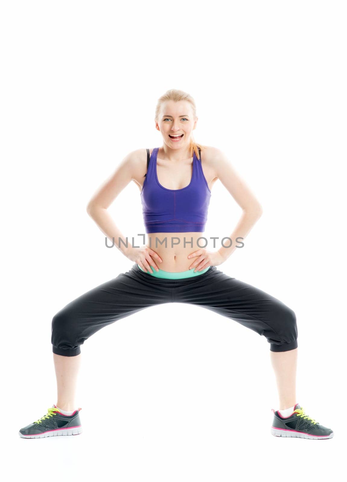 Blonde girl does gymnastics