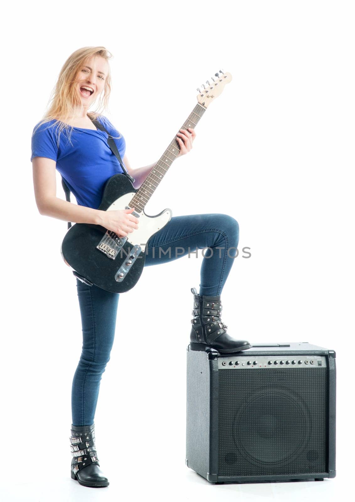 Blonde girl with guitar and amplifier