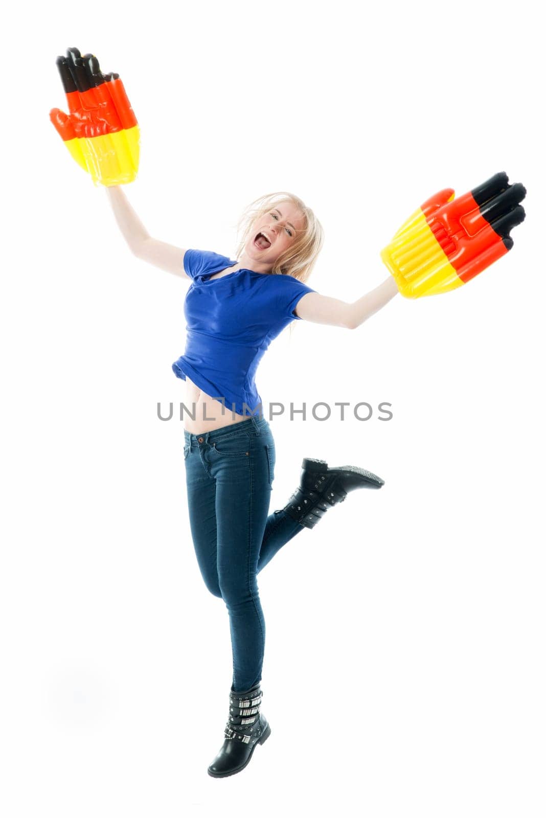 Blonde football fan with big fan gloves