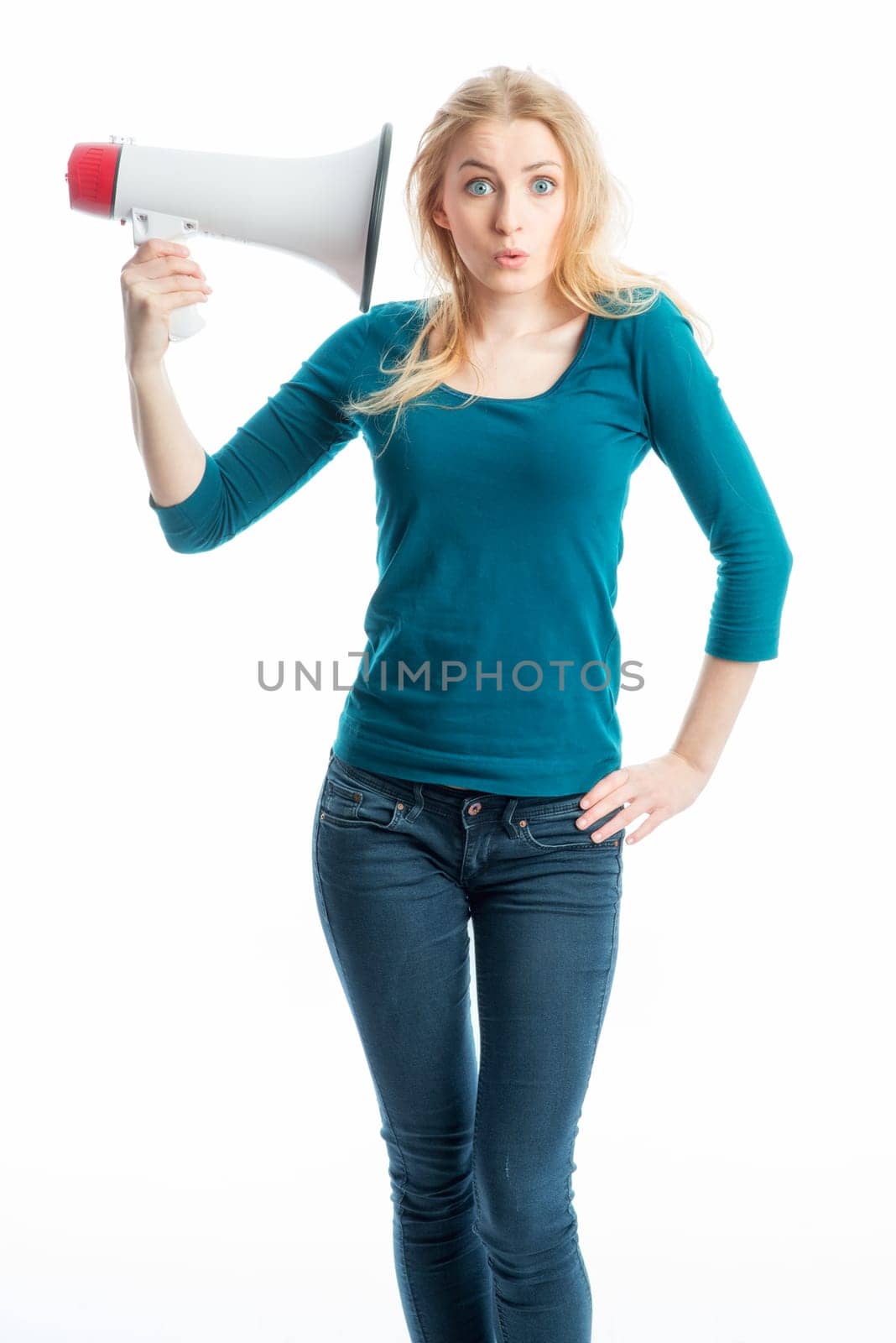 Blonde girl listens in a megaphone