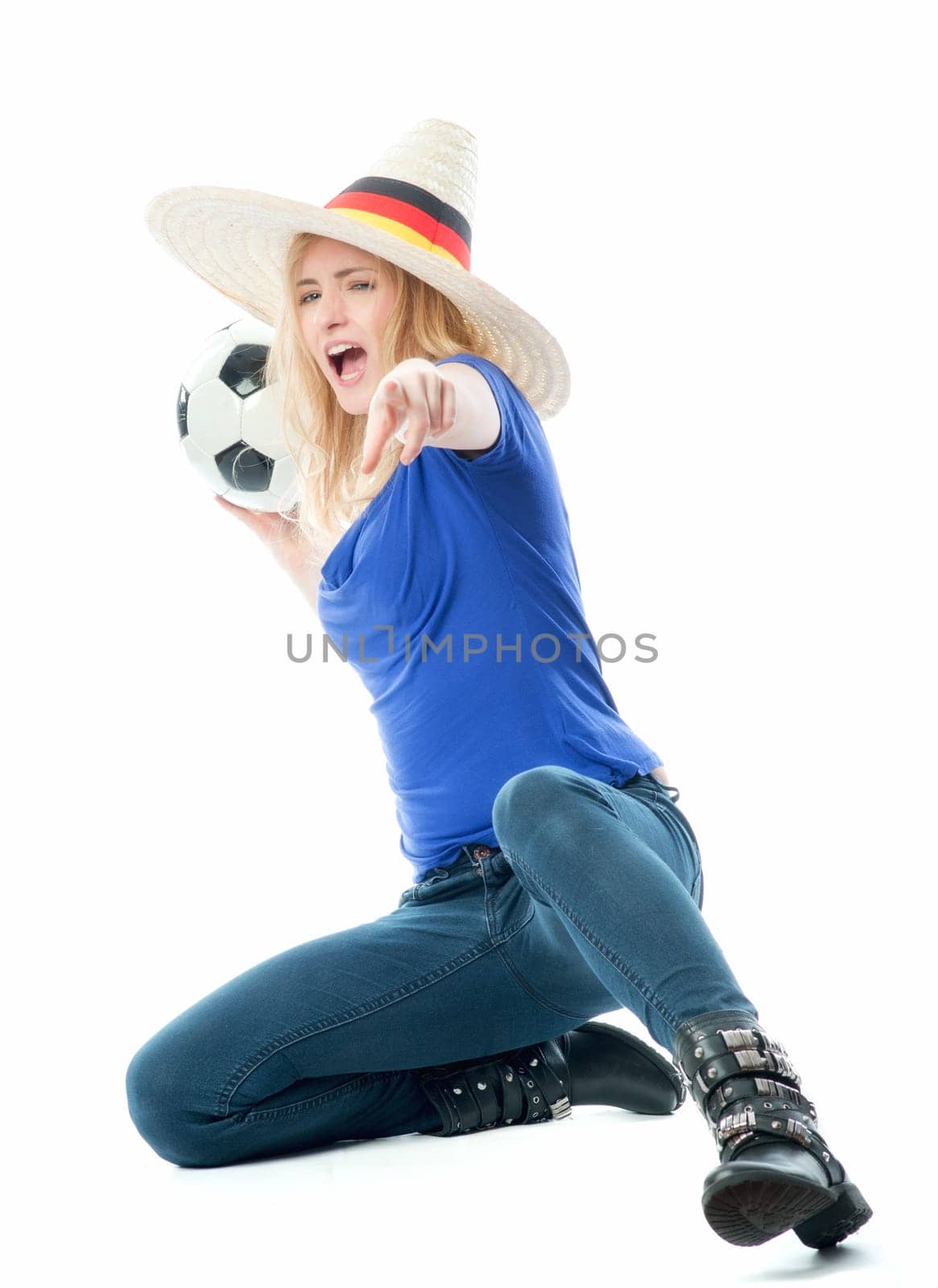Blonde football fan with fan hat and football