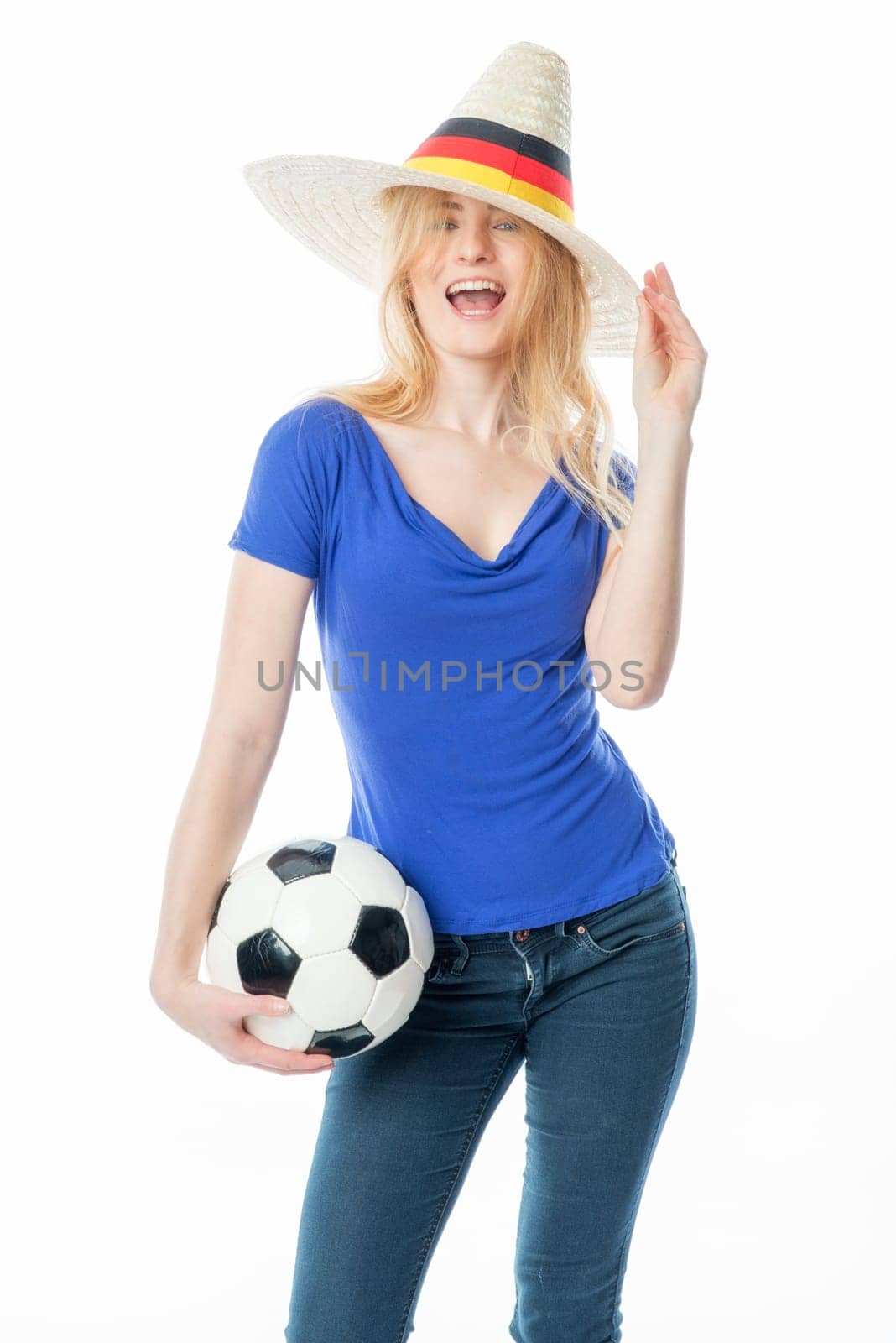 Blonde football fan with fan hat and football