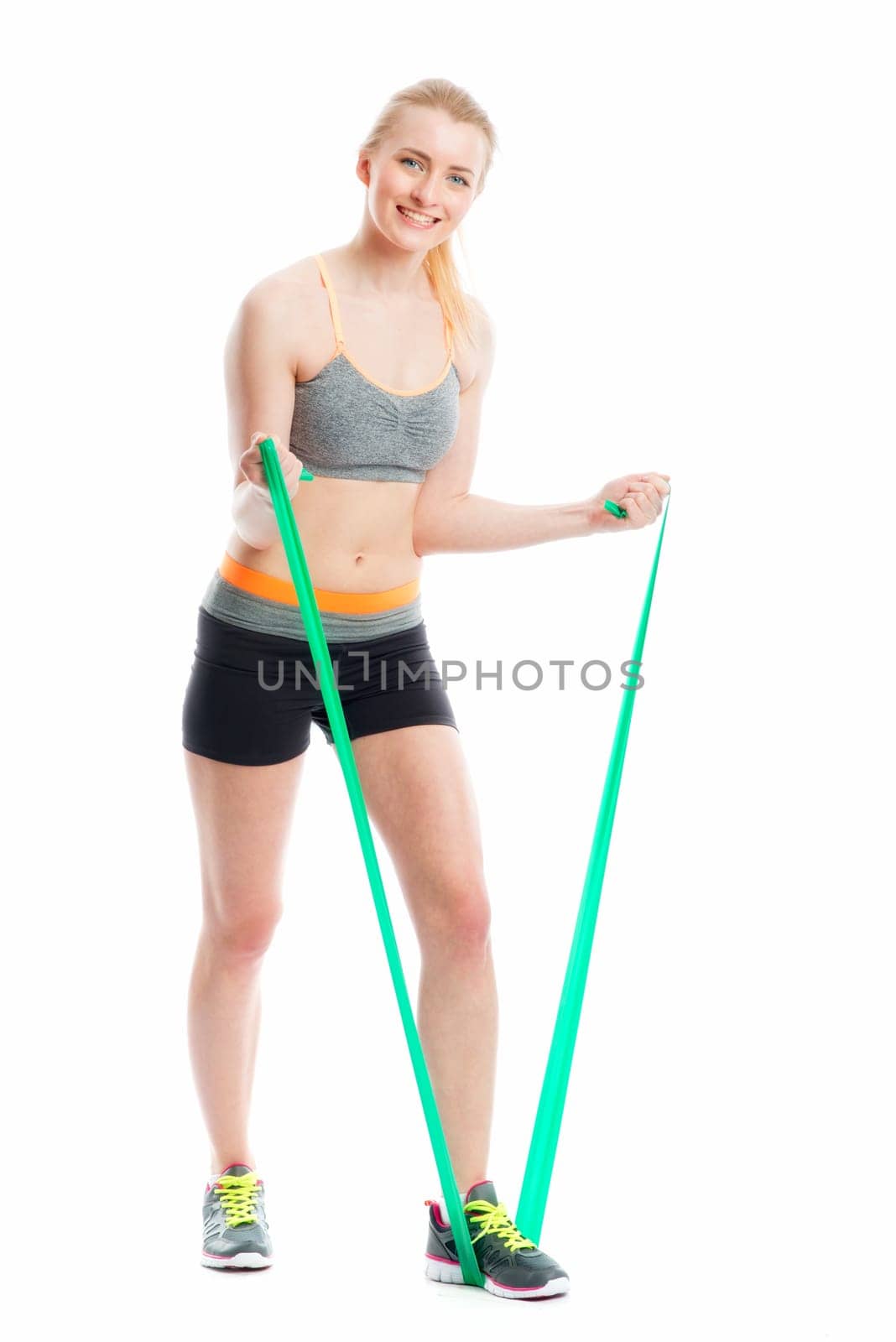 Blonde athlete trains with Theraband