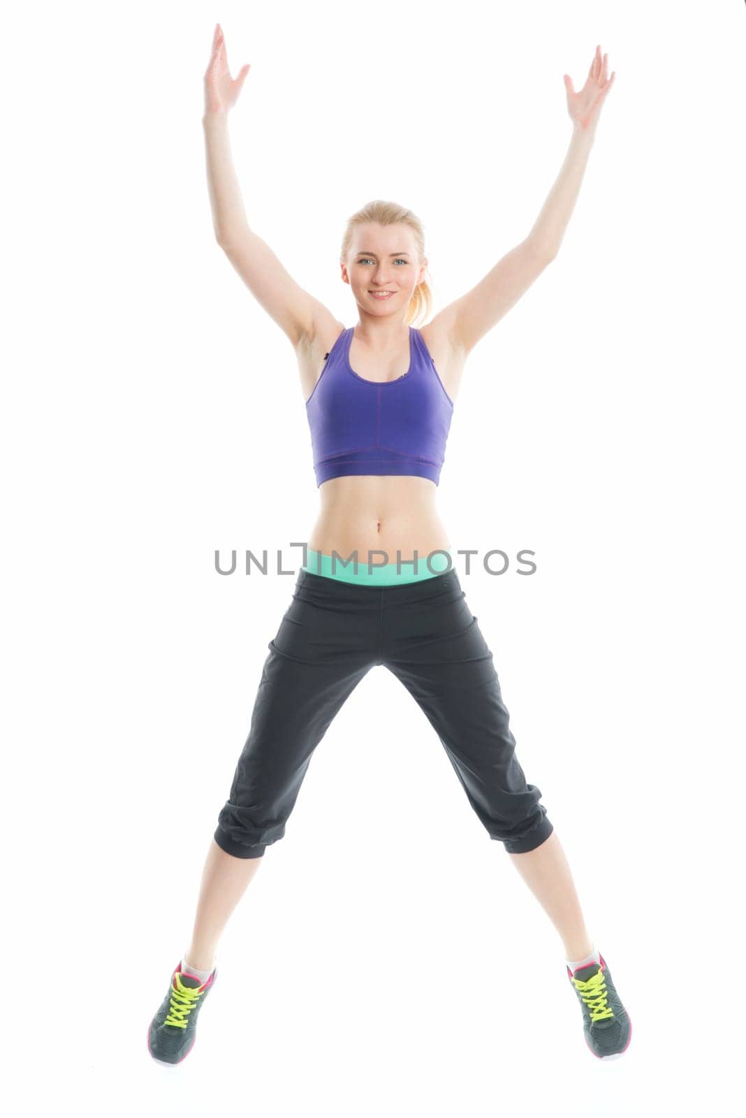 Blonde girl does fitness exercises