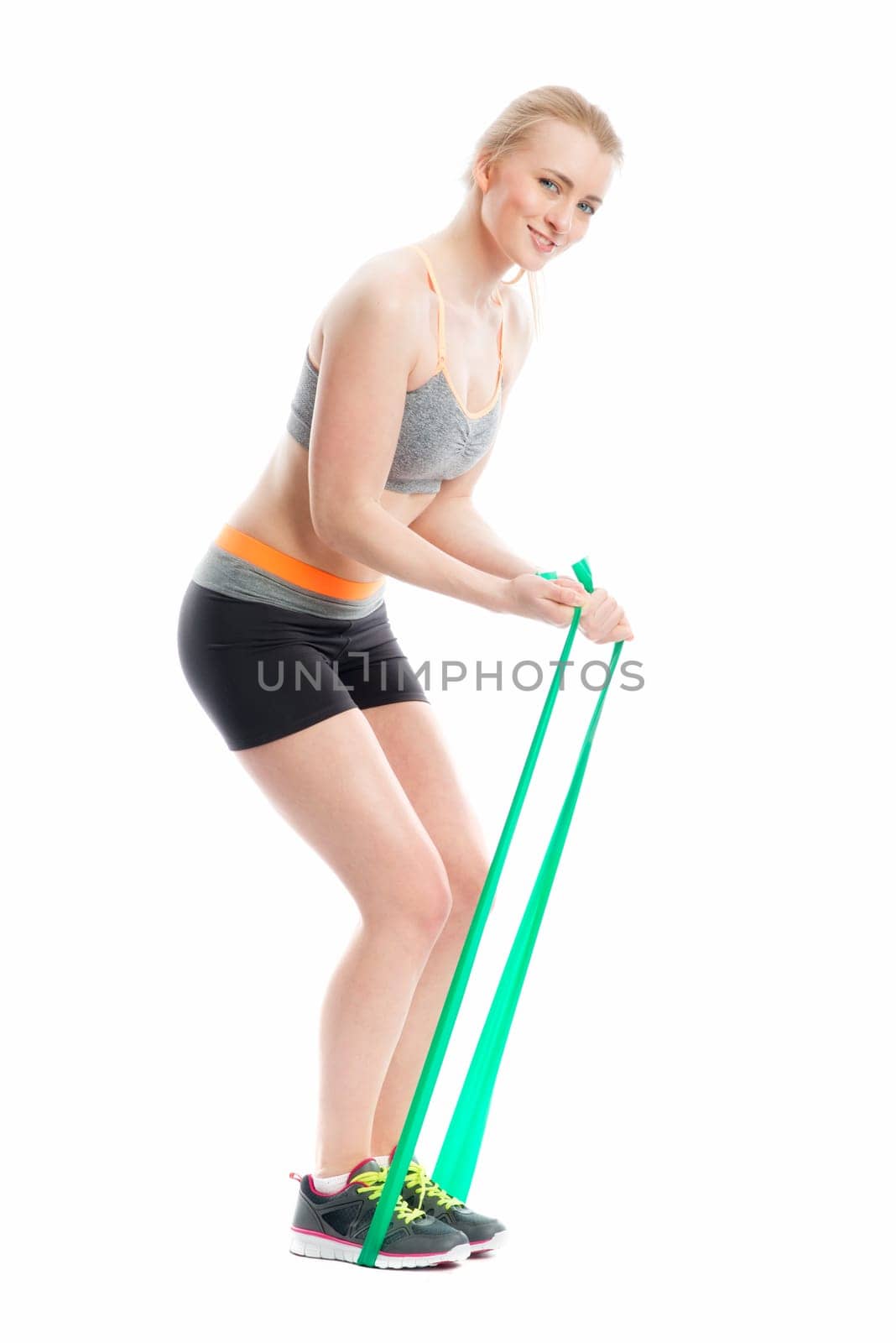 Blonde athlete trains with Theraband