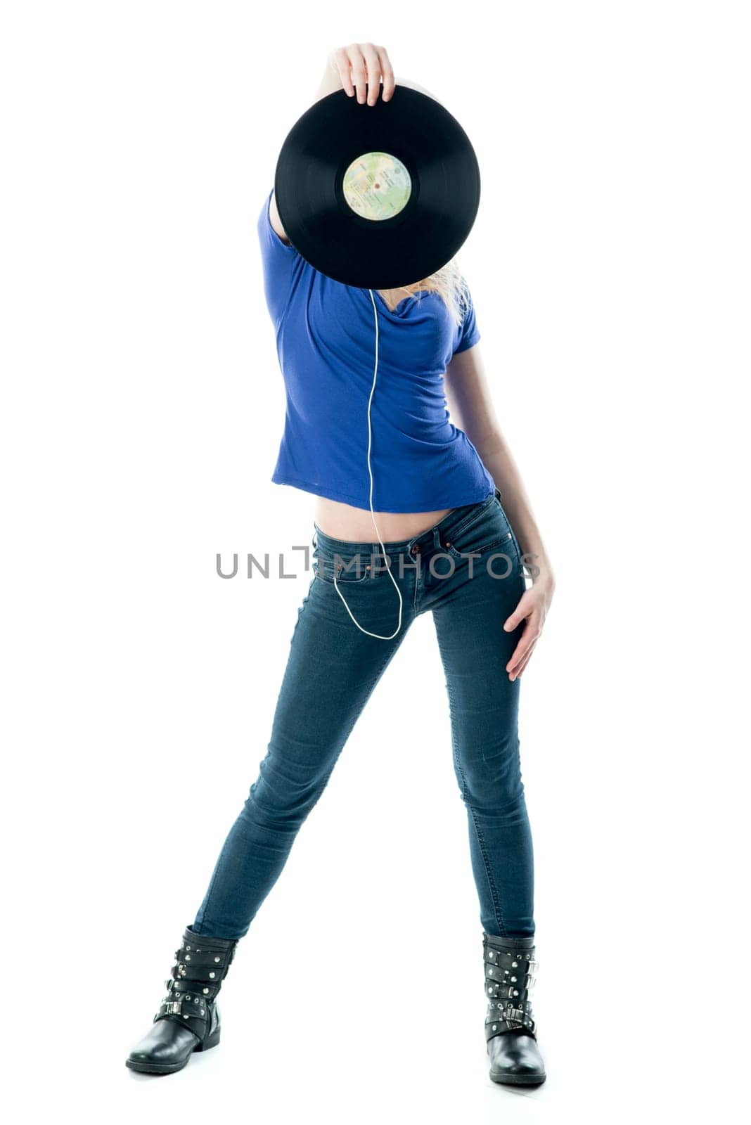 Blonde girl hides behind a record
