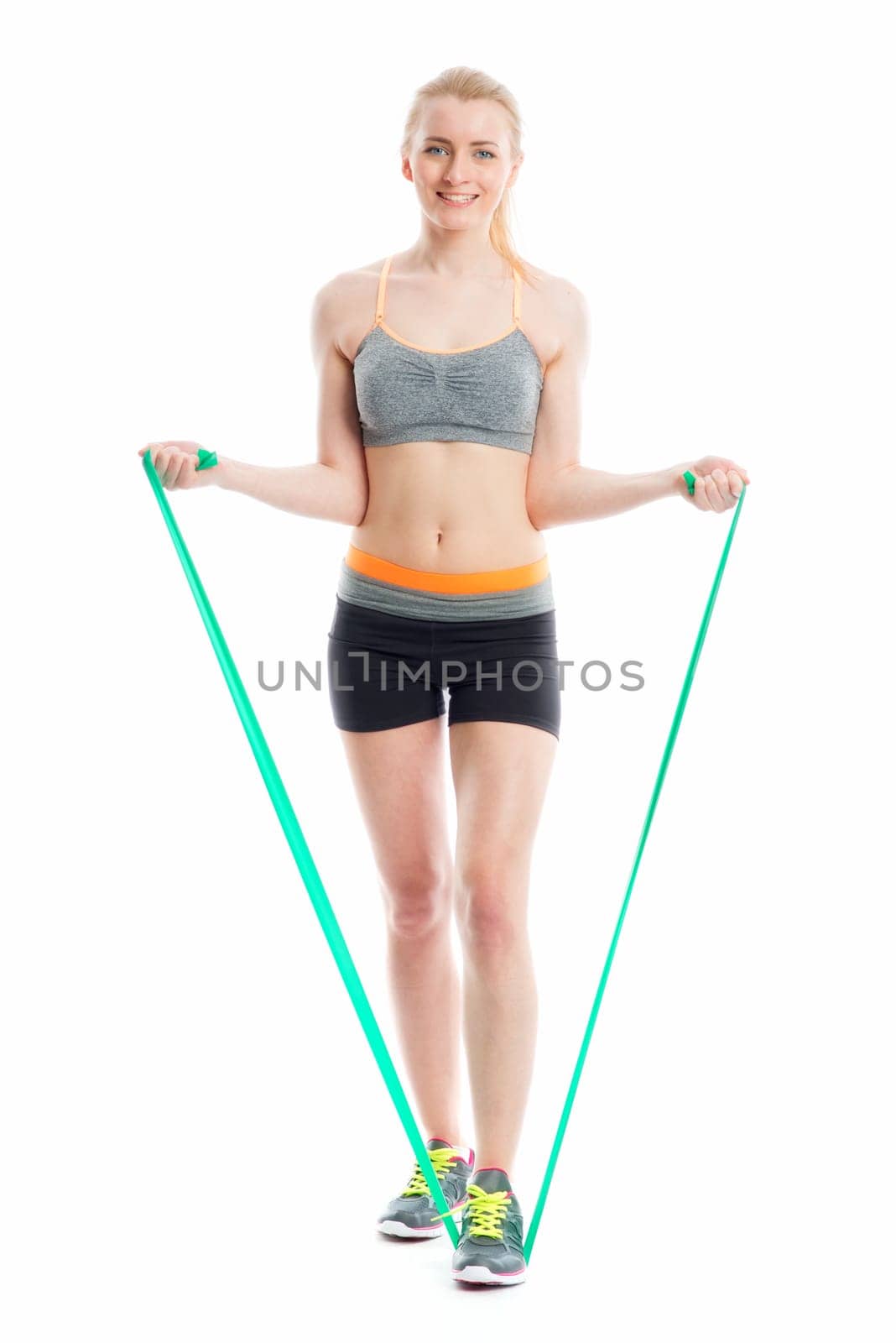 Blonde athlete trains with Theraband