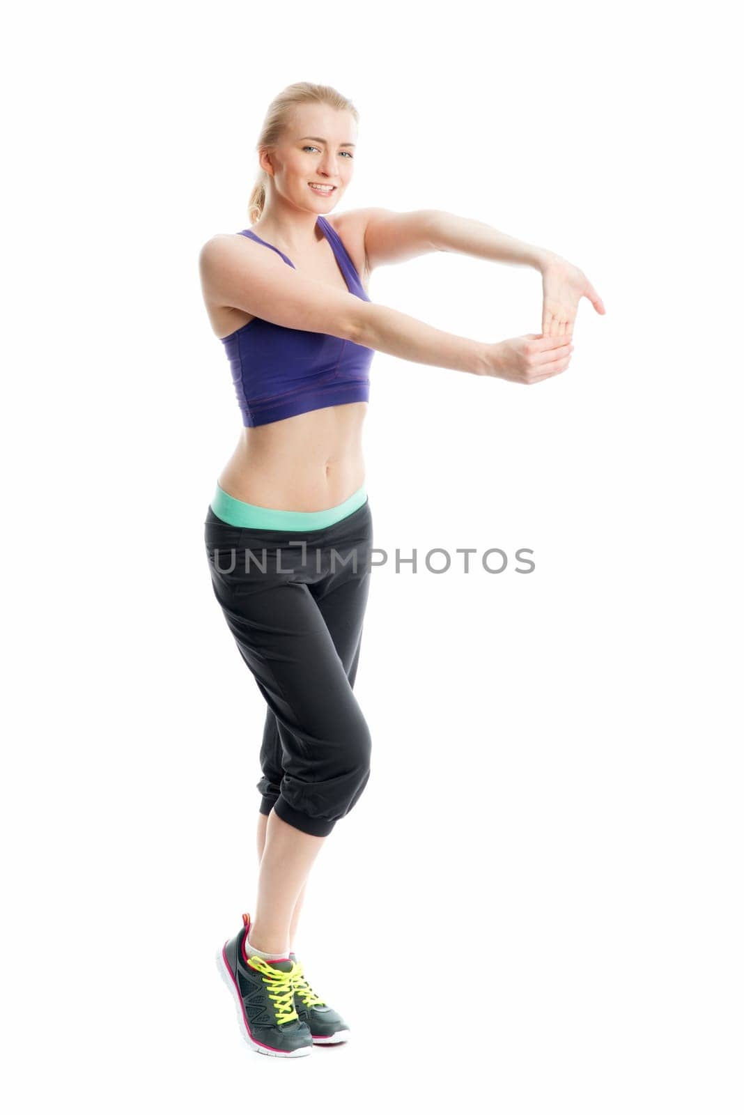 Blonde athlete does fitness exercises