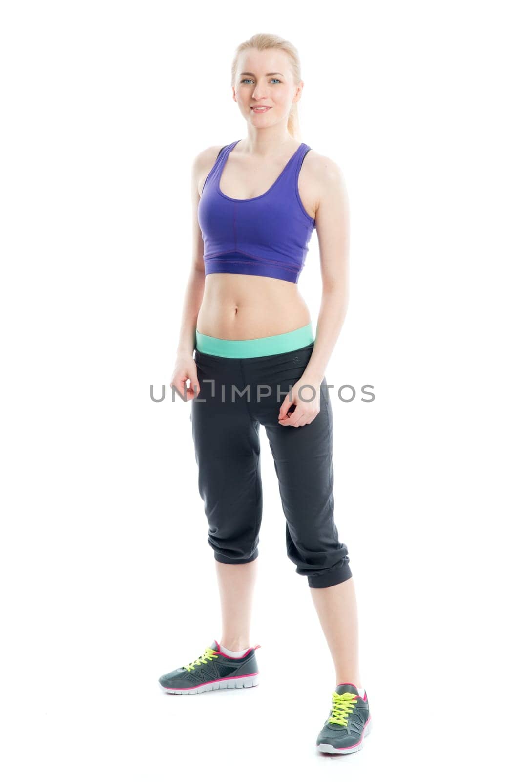 Blonde girl does fitness exercises