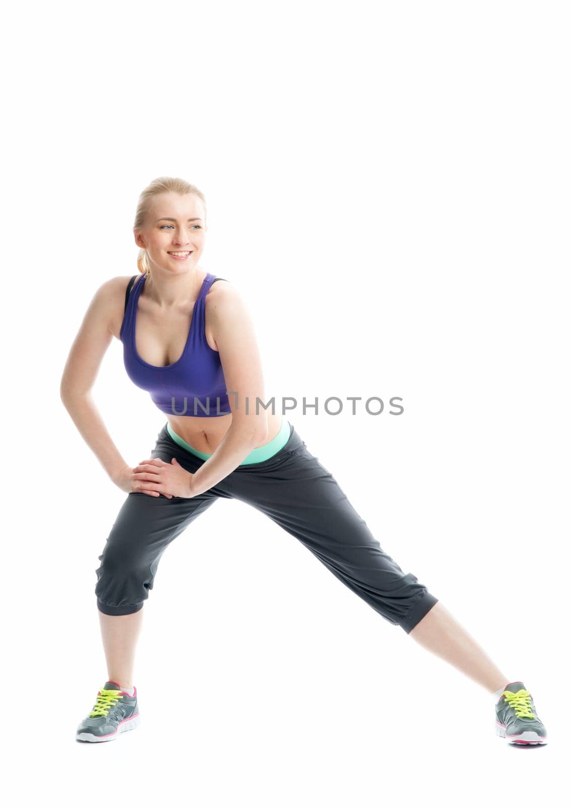 Blonde girl does fitness exercises