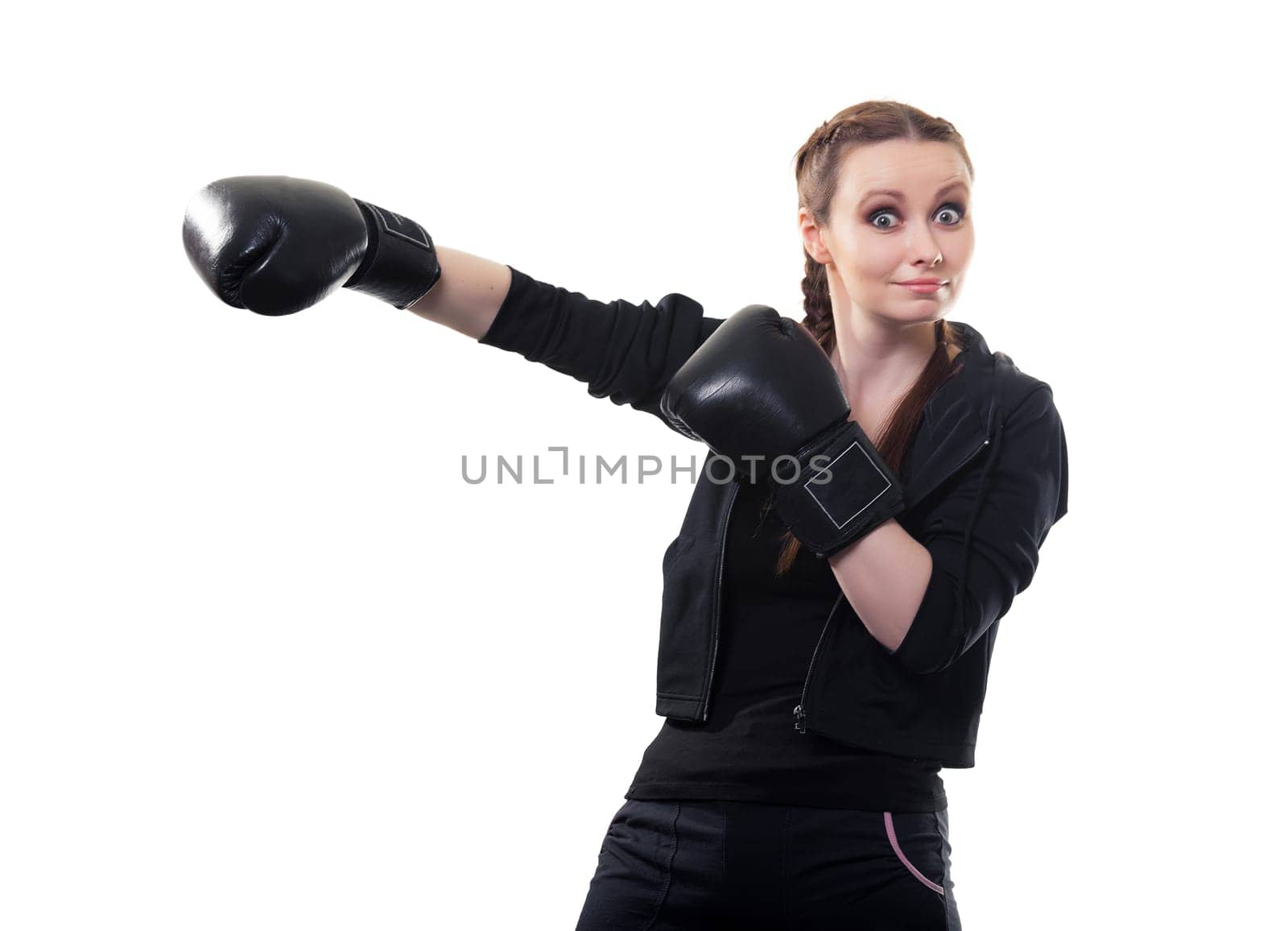 Young funny woman in boxing gloves on a white background