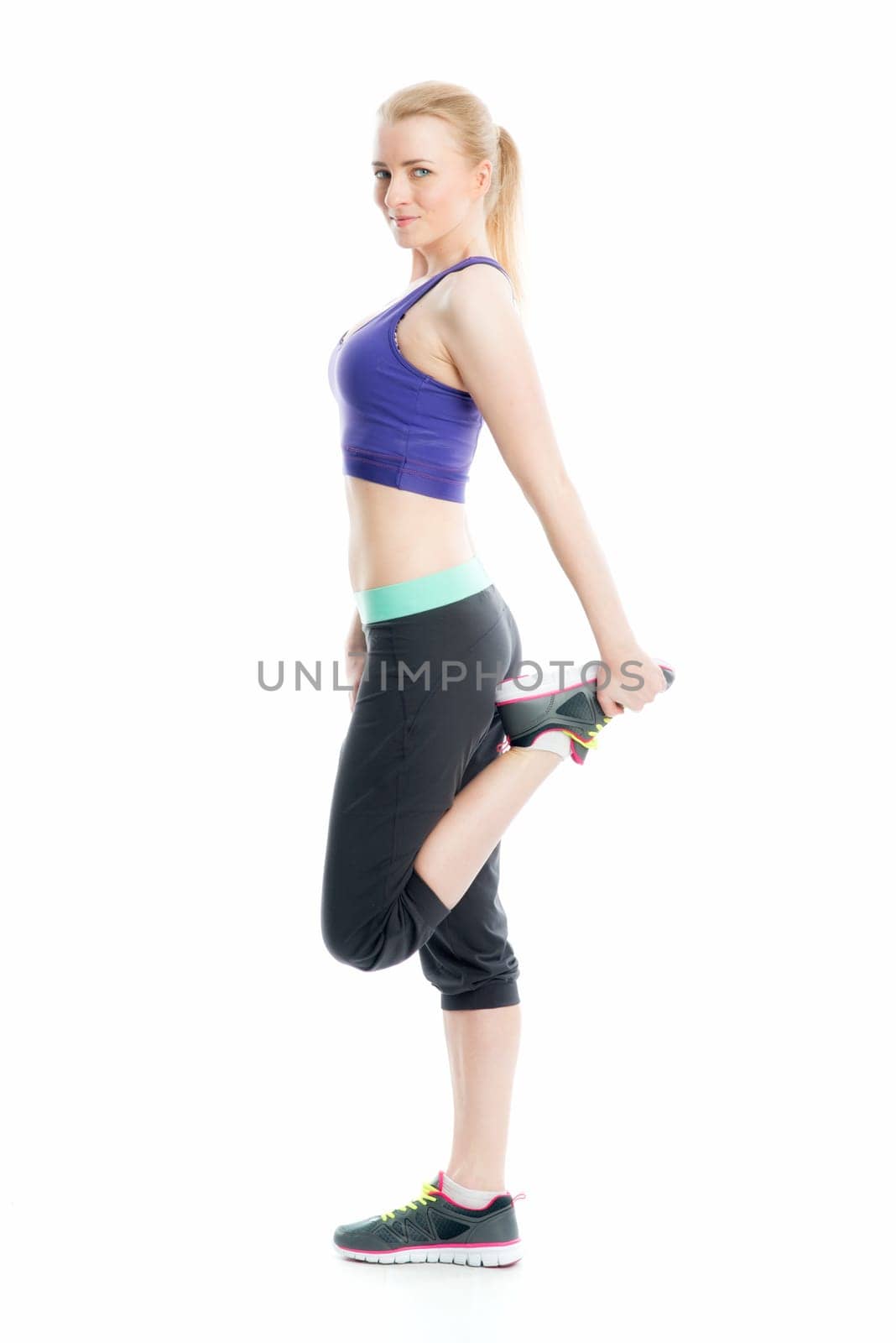 Blonde girl does fitness exercises