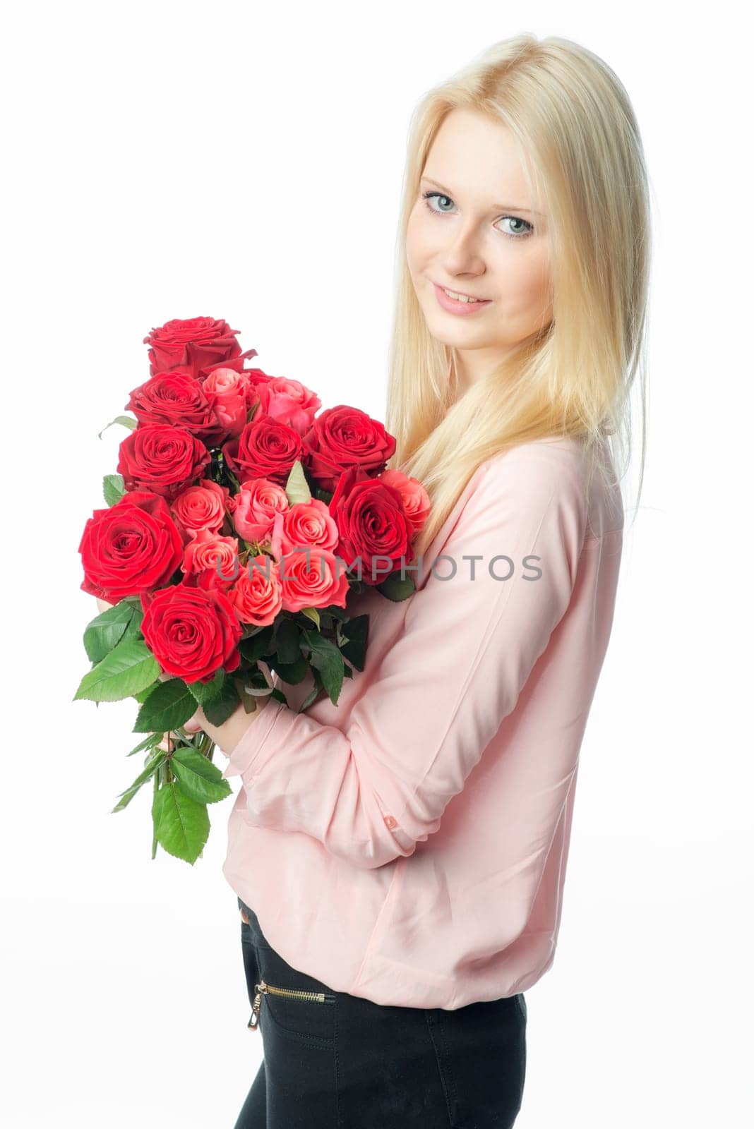 Blonde girl with bouquet of roses