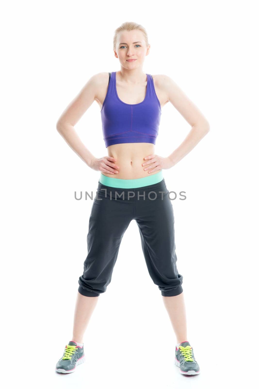 Blonde girl does fitness exercises