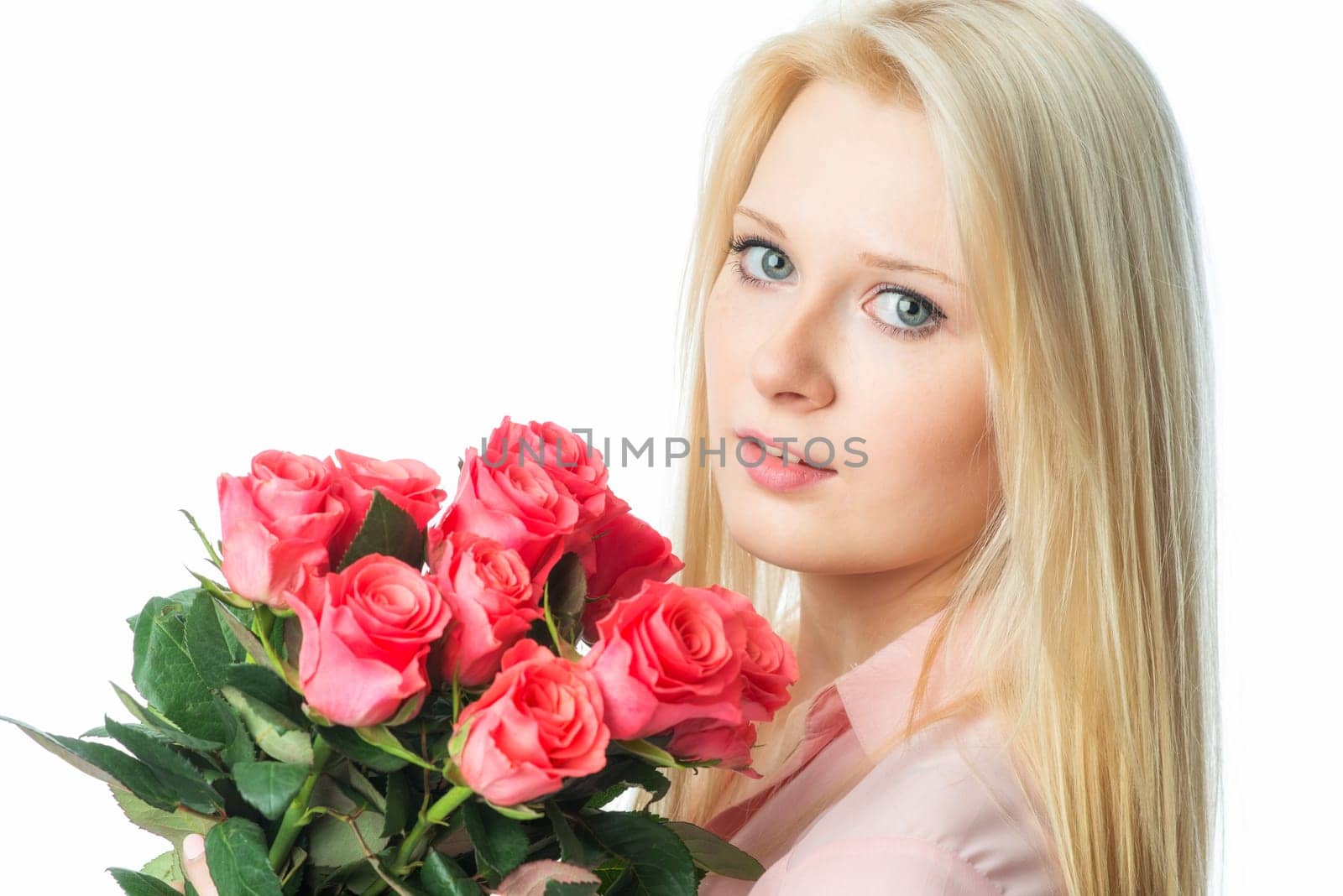 Blonde girl with bouquet of roses