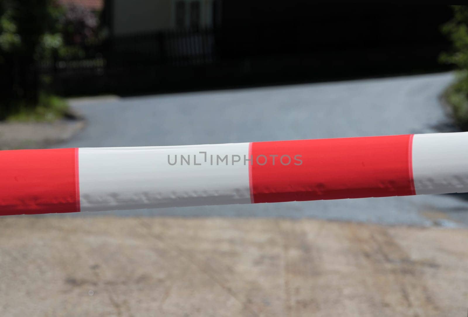The red-and-white barrier tape