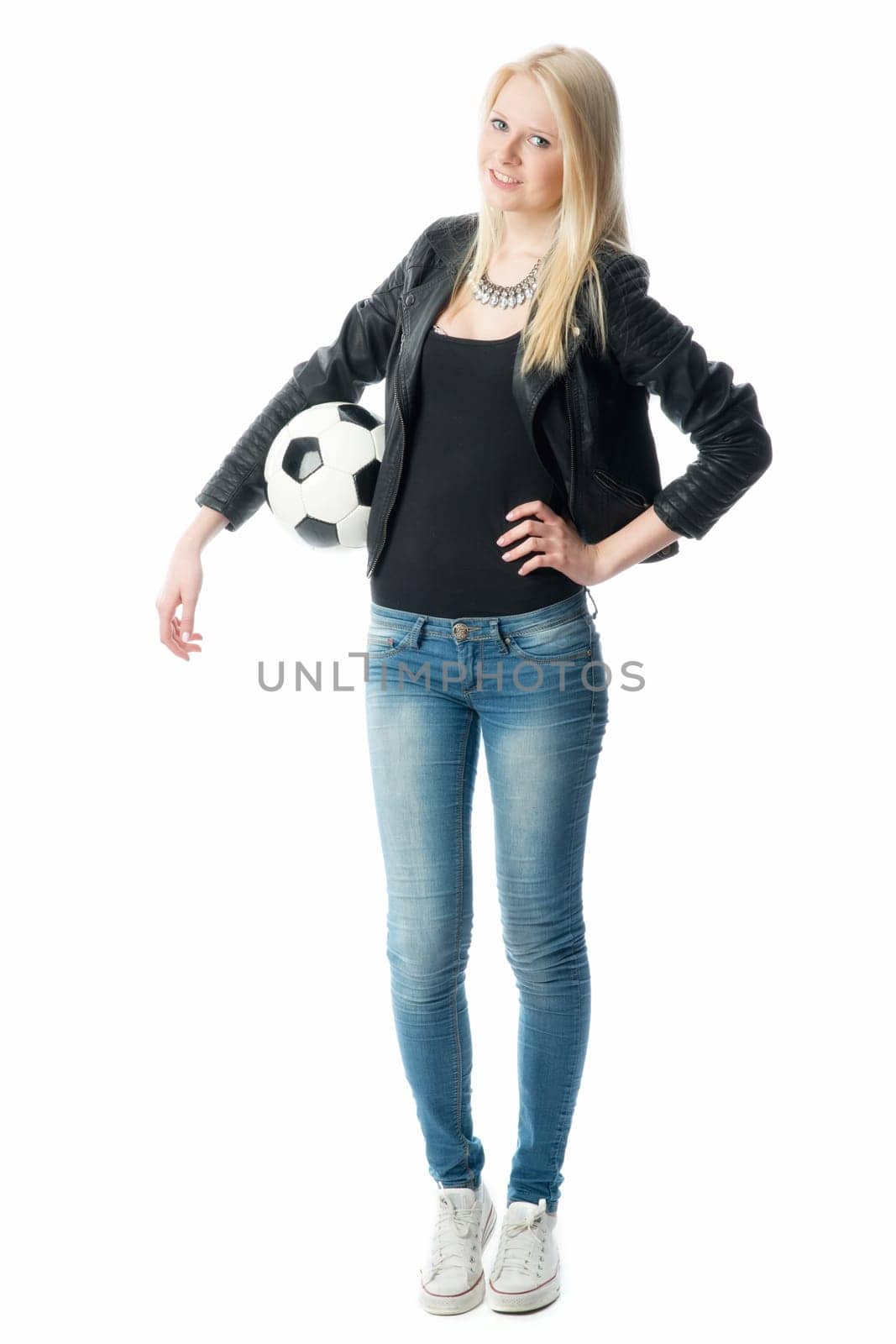 Blonde girl in leather jacket with football