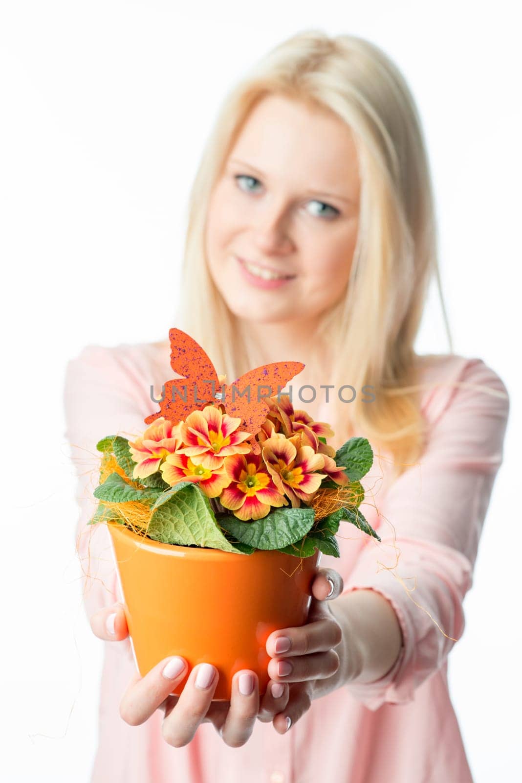 Blonde girl with potted plant