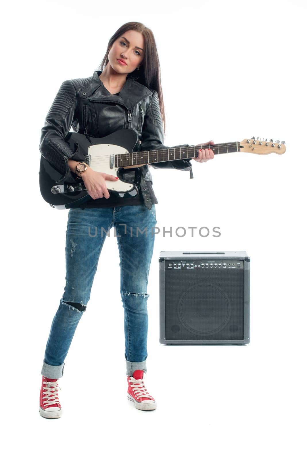 Race woman with electric guitar and amplifier
