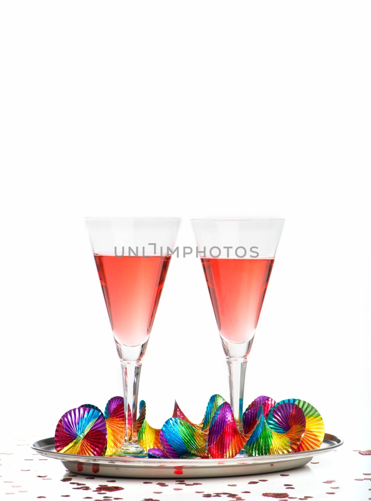 2 filled glasses of sparkling wine