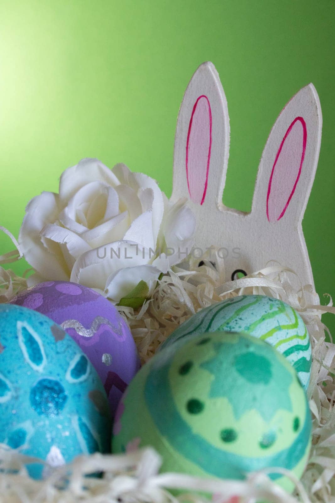 Easter eggs , flowers and funny bunny to celebrate Easter. Wallpaper for Easter announcements and cards.Vertical real picture, ideal for social media stories and postings