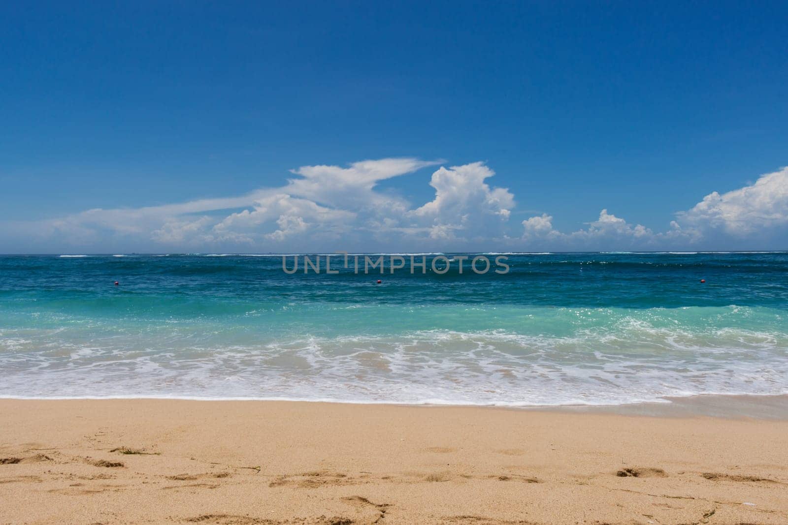 Beautiful secluded sandy beach in the Caribbean with white sand and blue sky as in paradise