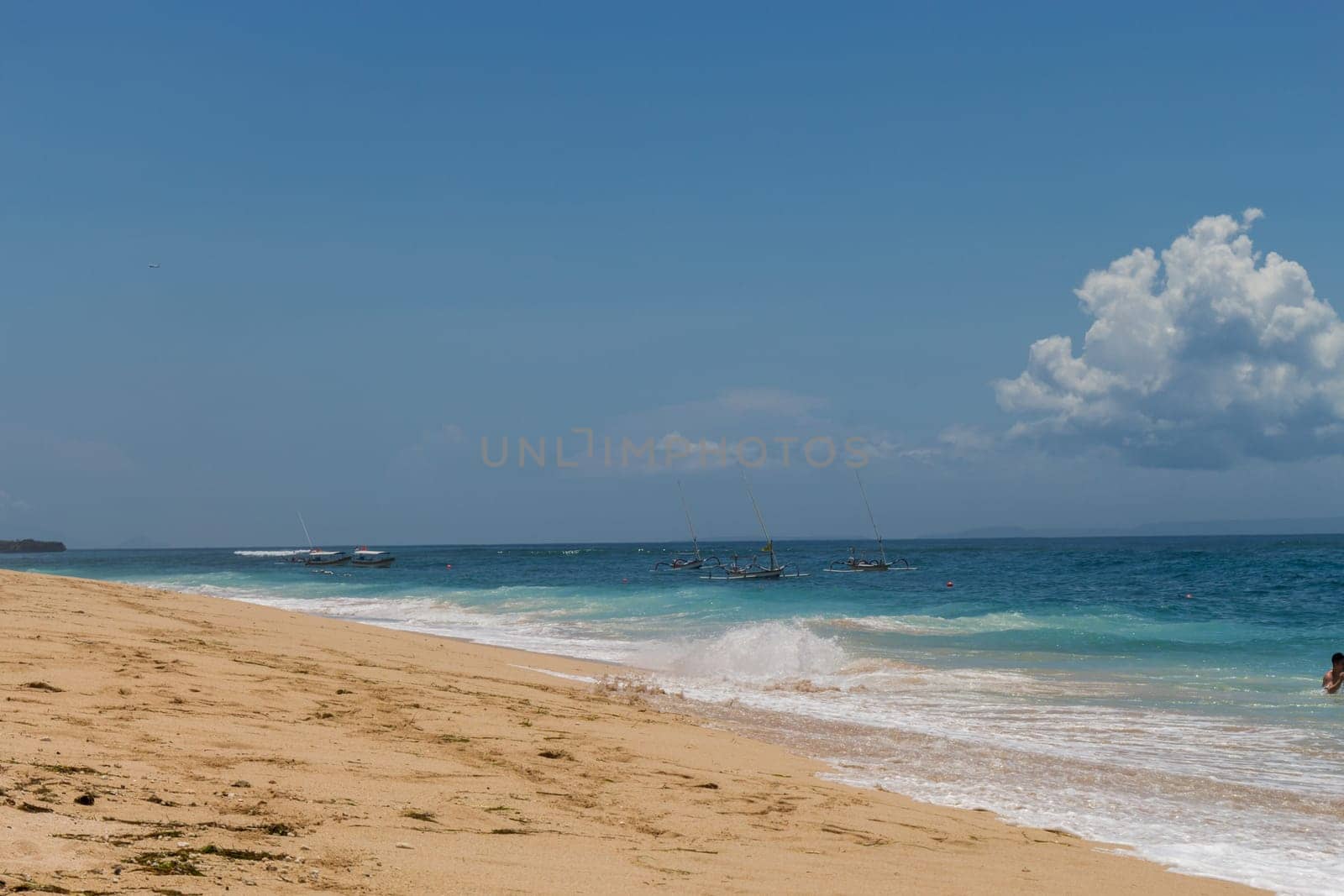 Beautiful secluded sandy beach in the Caribbean with white sand and blue sky as in paradise