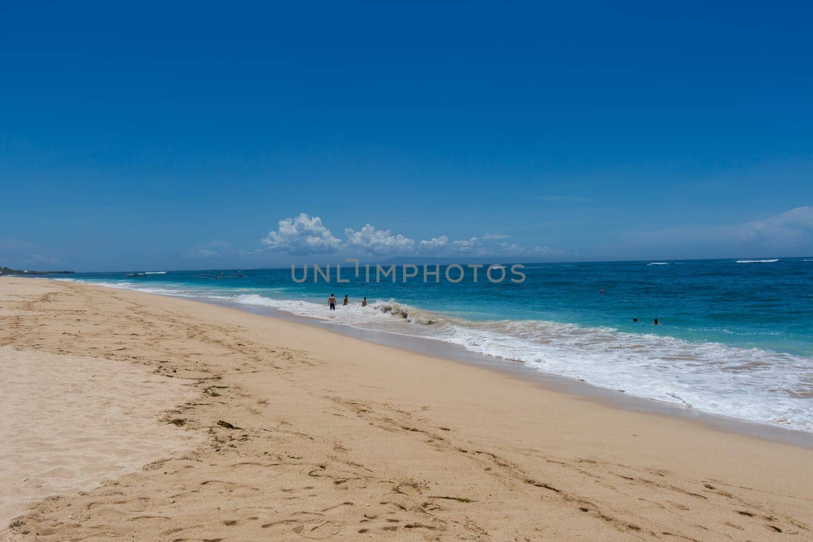 Beautiful secluded sandy beach in the Caribbean with white sand and blue sky as in paradise