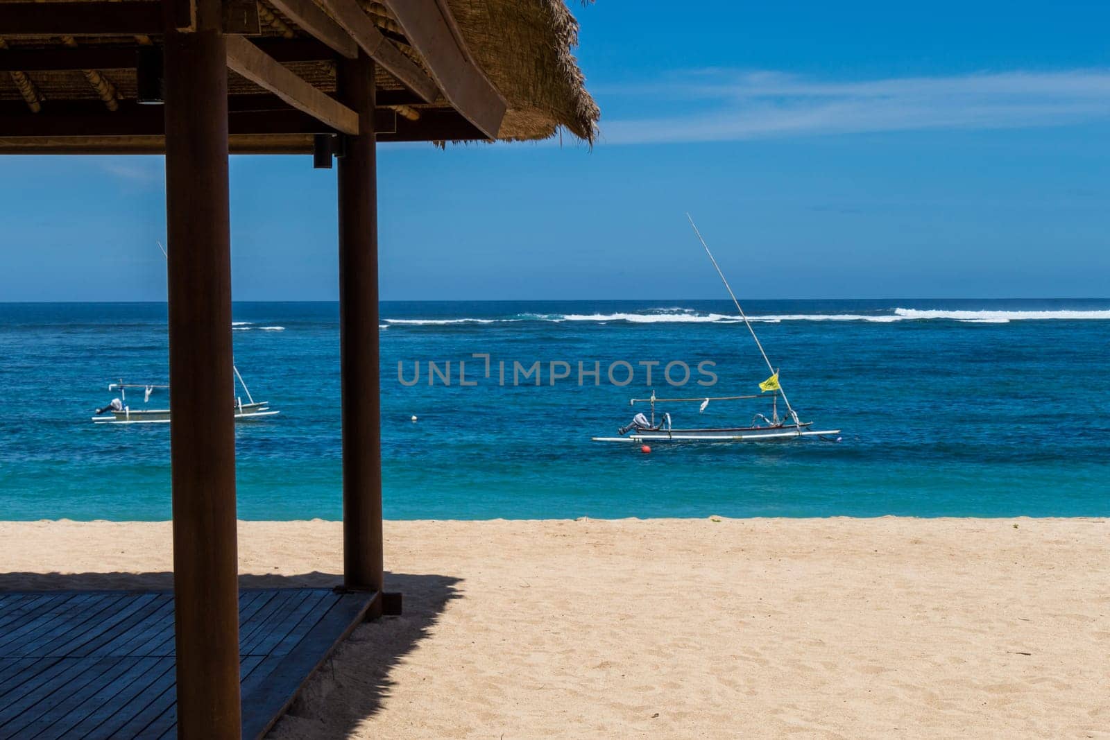 Beautiful secluded sandy beach in the Caribbean with white sand and blue sky as in paradise