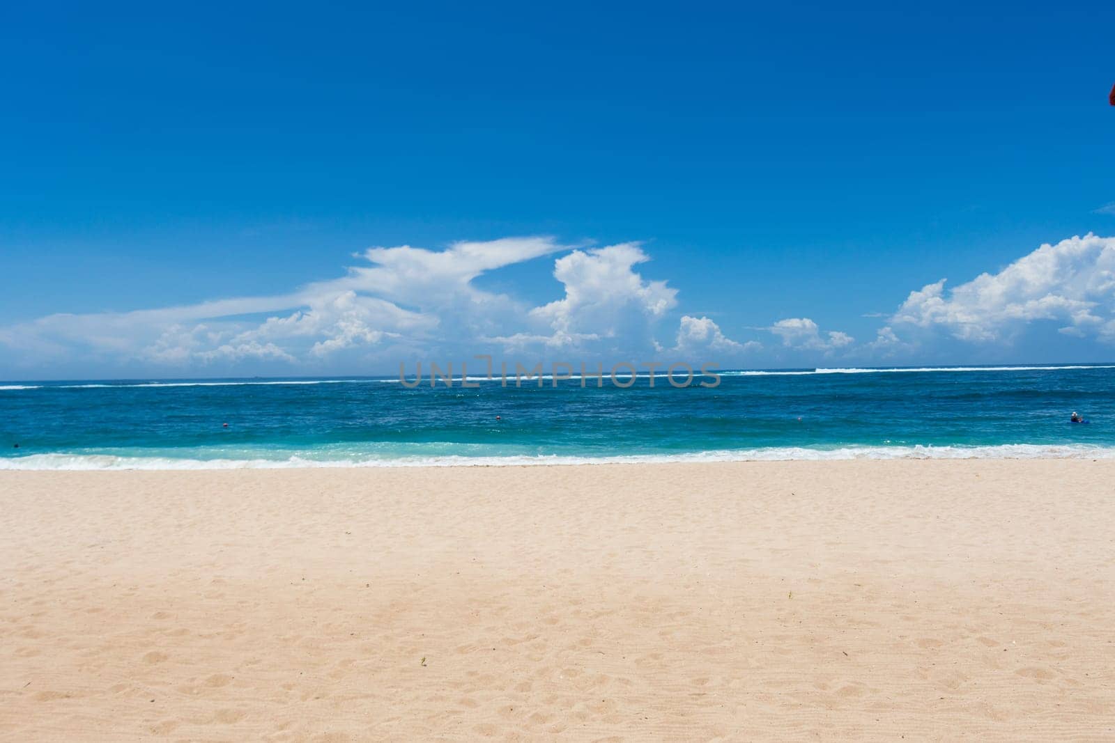 Beautiful secluded sandy beach in the Caribbean with white sand and blue sky as in paradise