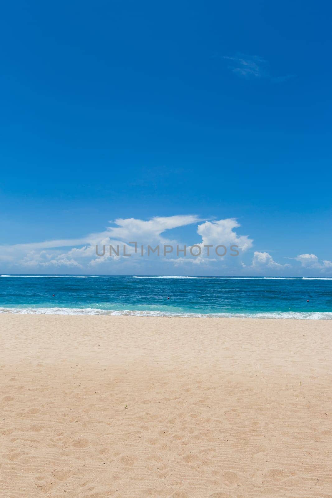 Beautiful secluded sandy beach in the Caribbean with white sand and blue sky as in paradise