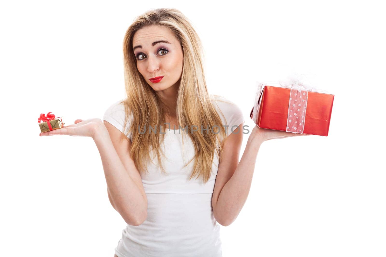 Young attractive woman with gifts rejoices and laughs isolated against white background
