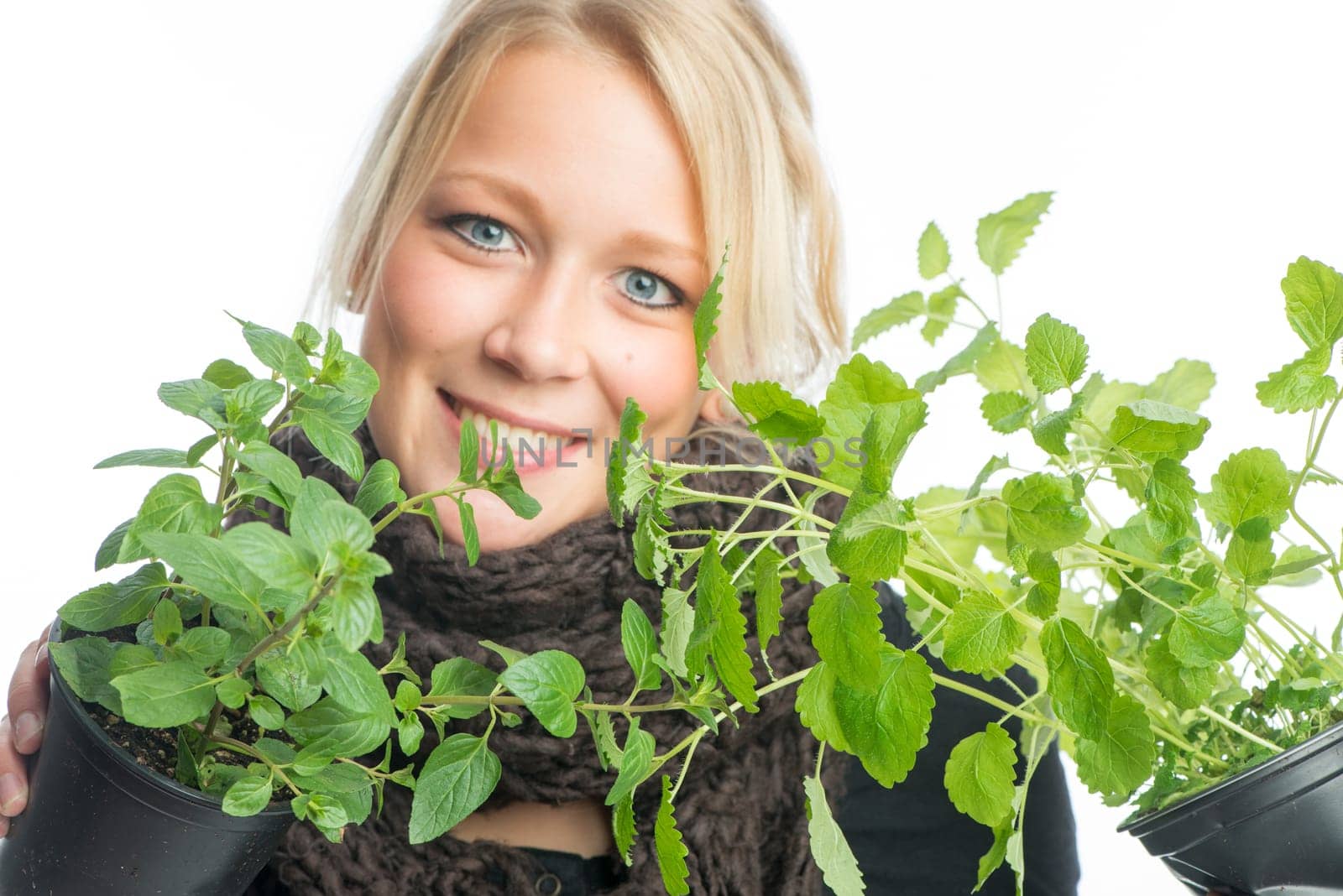 Blonde woman with medicinal plants
