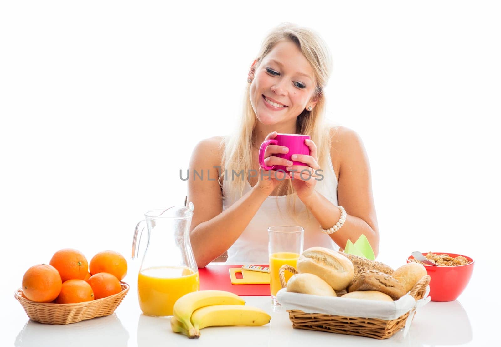 Blonde woman at the covered breakfast table