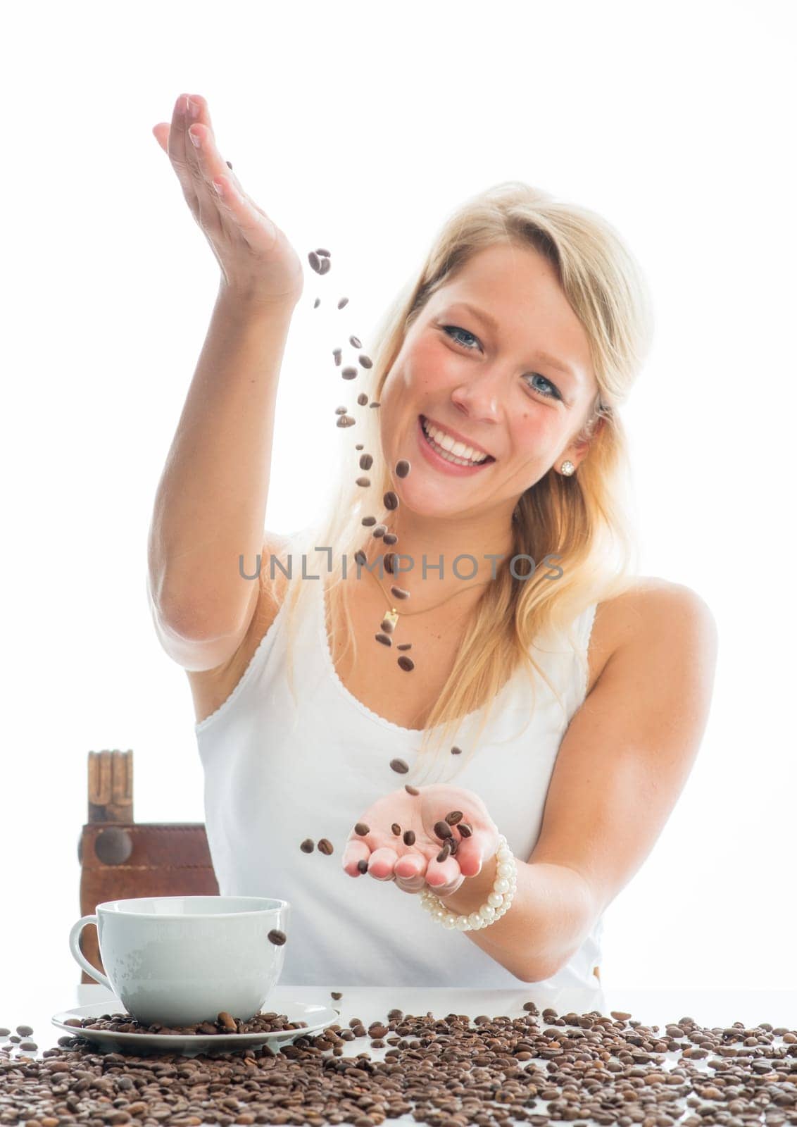 Young woman with coffee beans
