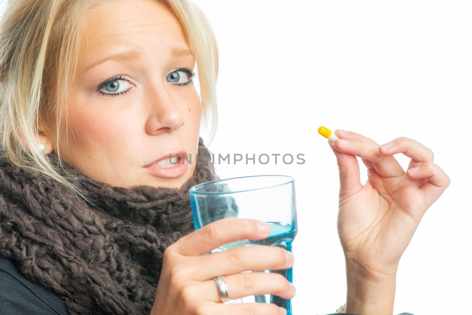 Sick blonde woman with medication
