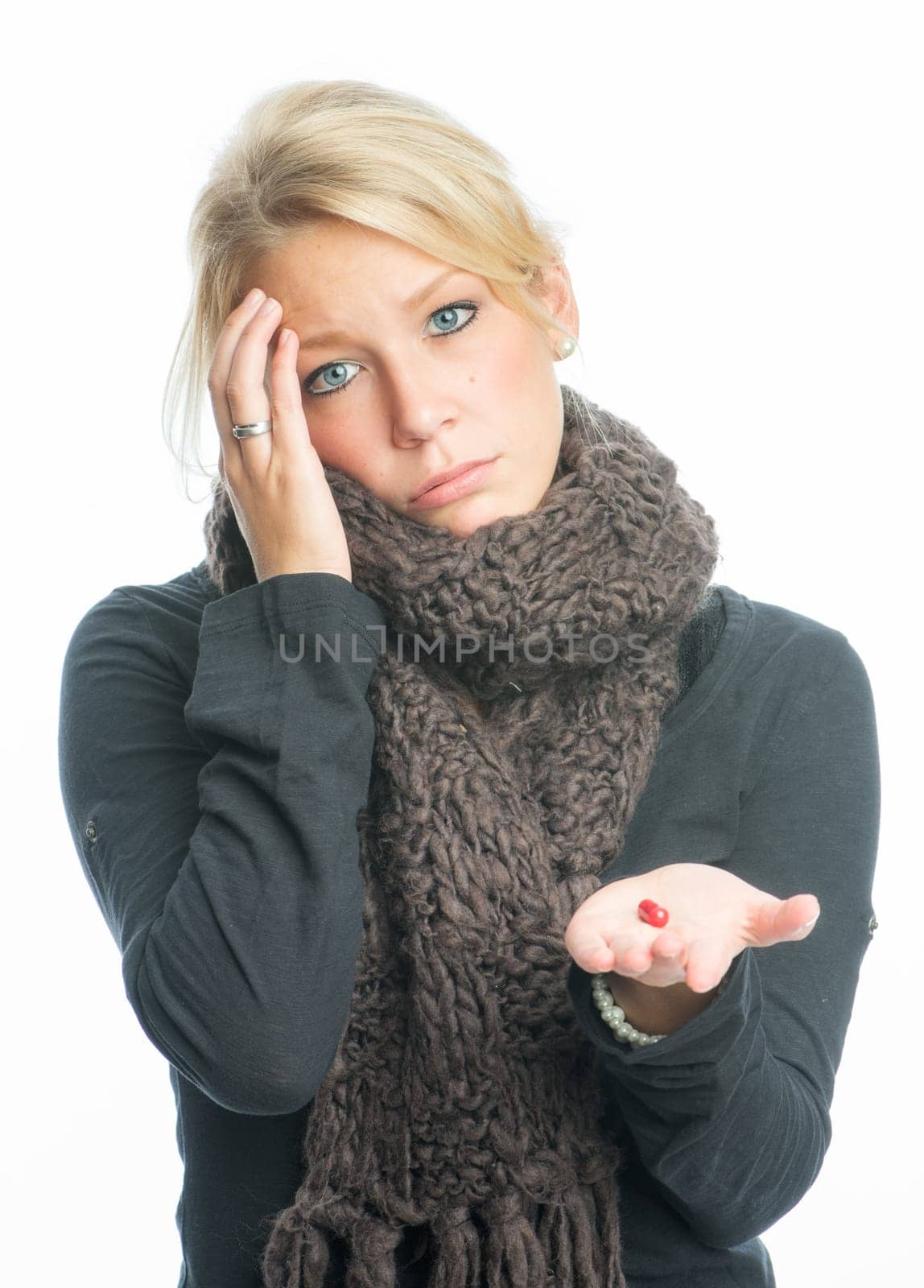 Sick blonde woman with medication