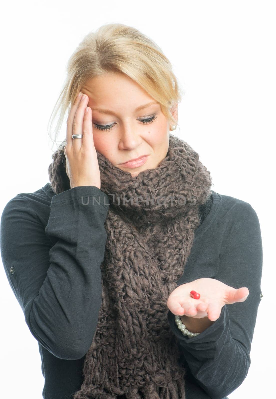 Sick blonde woman with medication