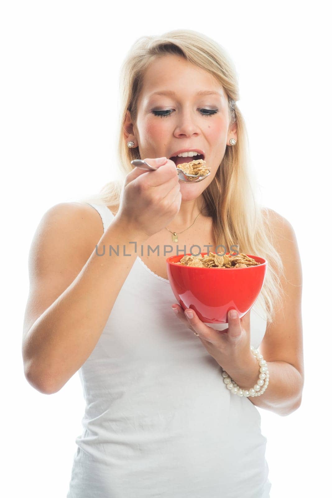 Blonde woman holds a breakfast bowl