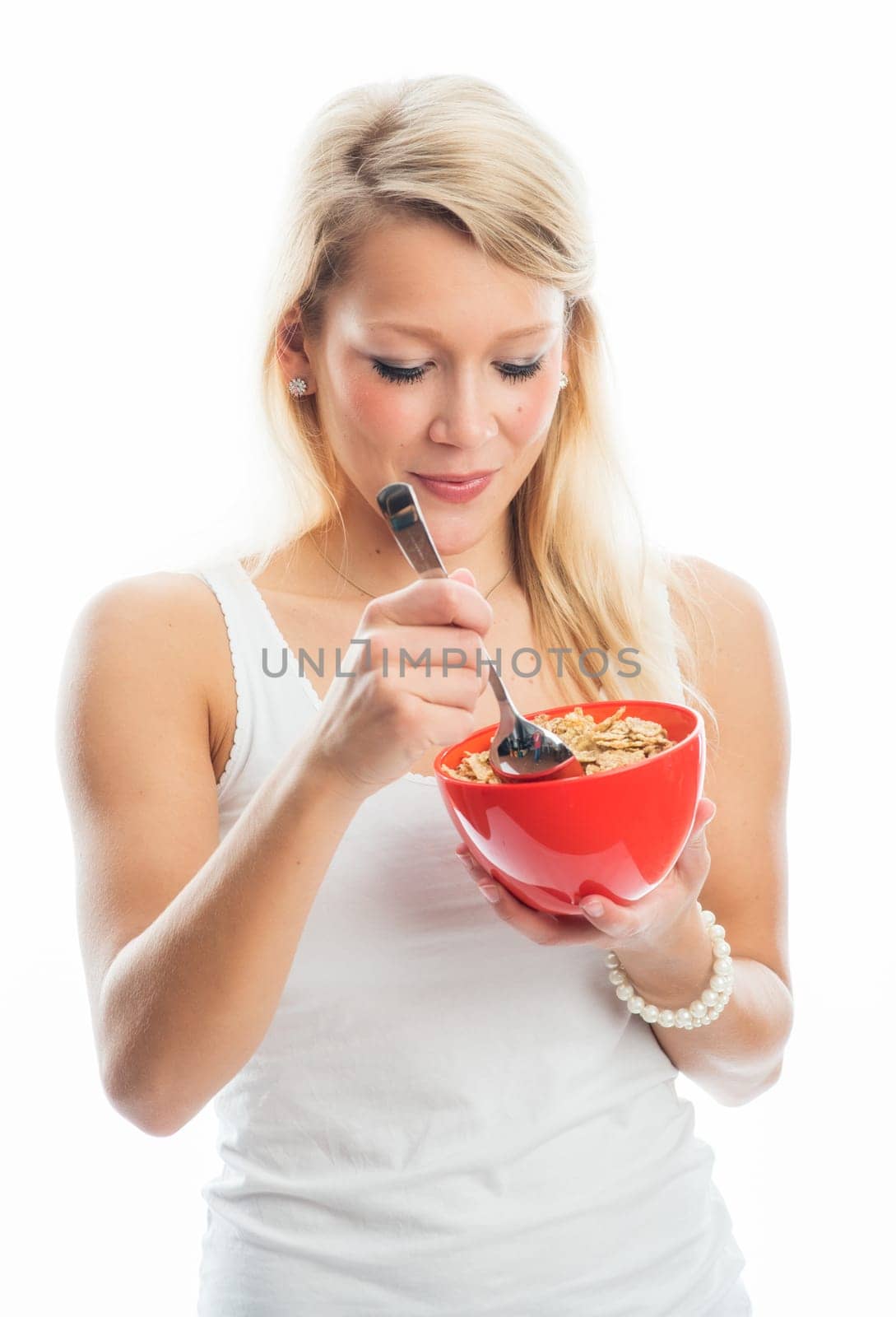 Blonde woman holds a breakfast bowl