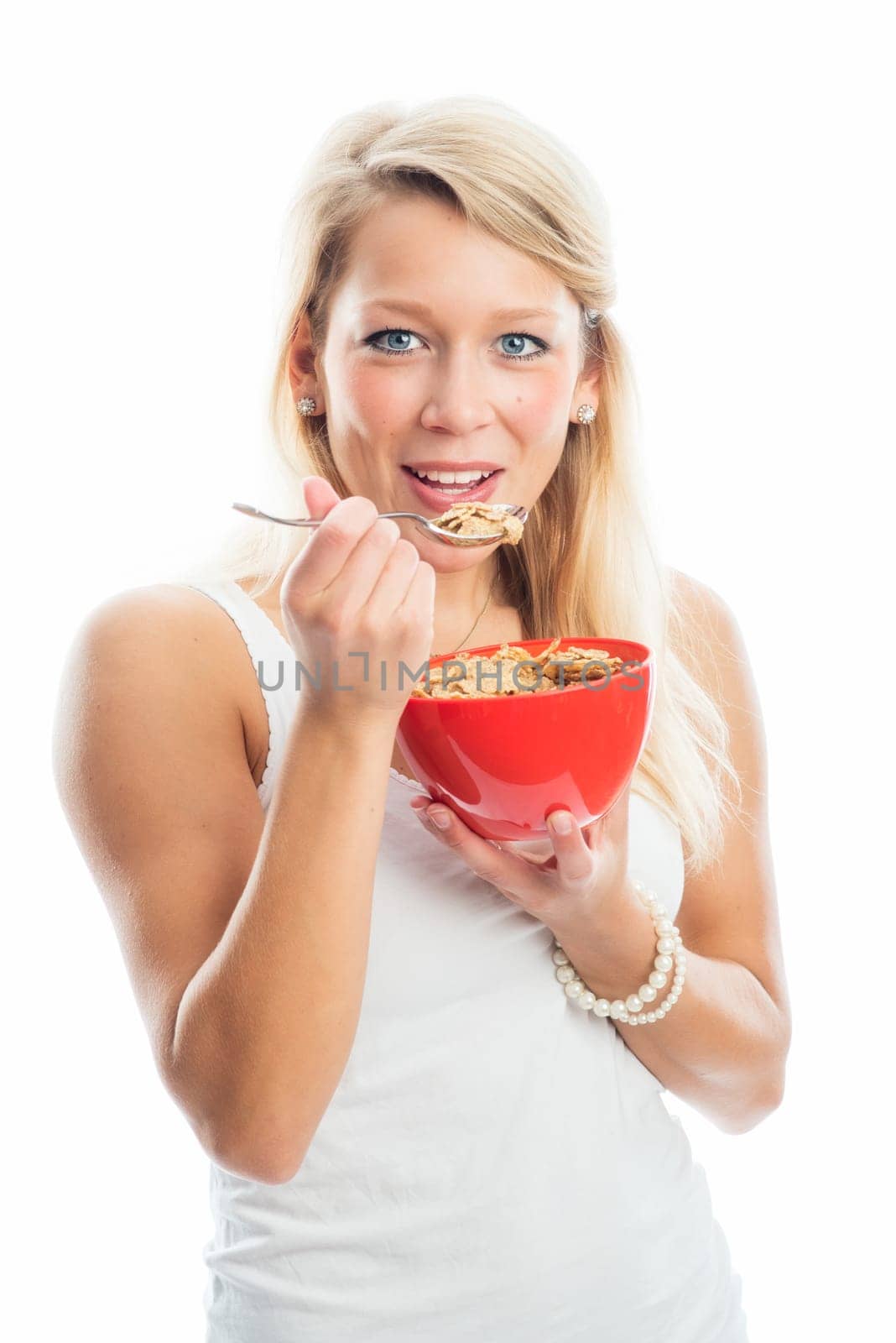Blonde woman holds a breakfast bowl