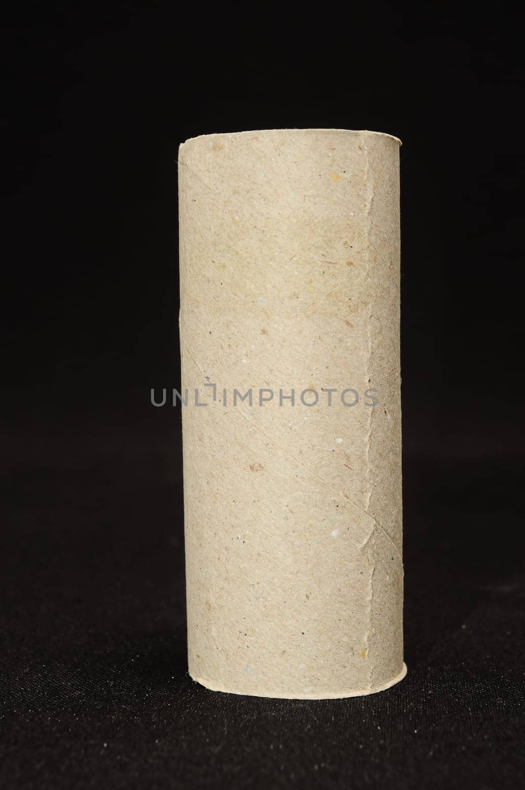 Empty Toilet Rolls Stack Up On a Black Background