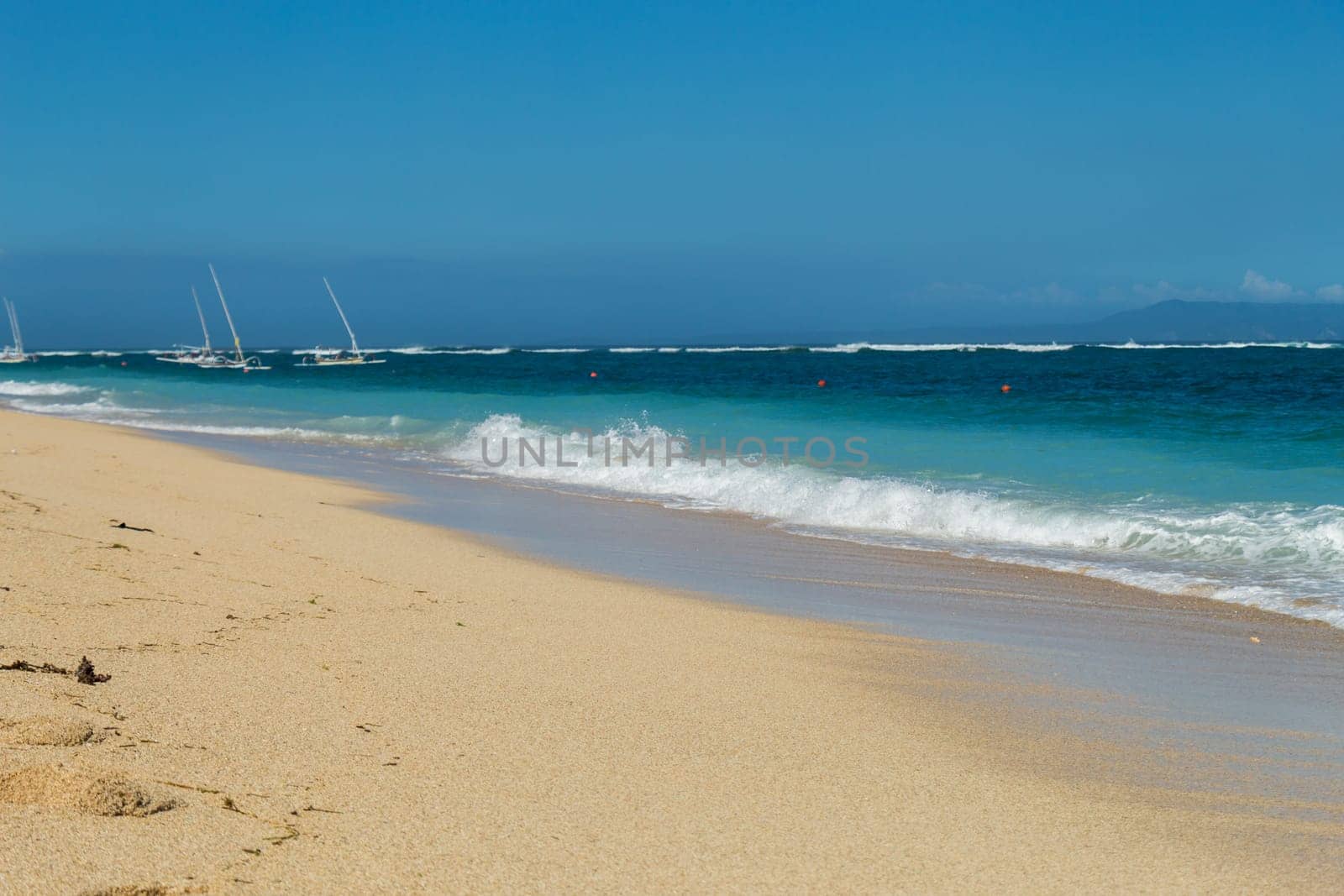 Beautiful secluded sandy beach in the Caribbean with white sand and blue sky as in paradise