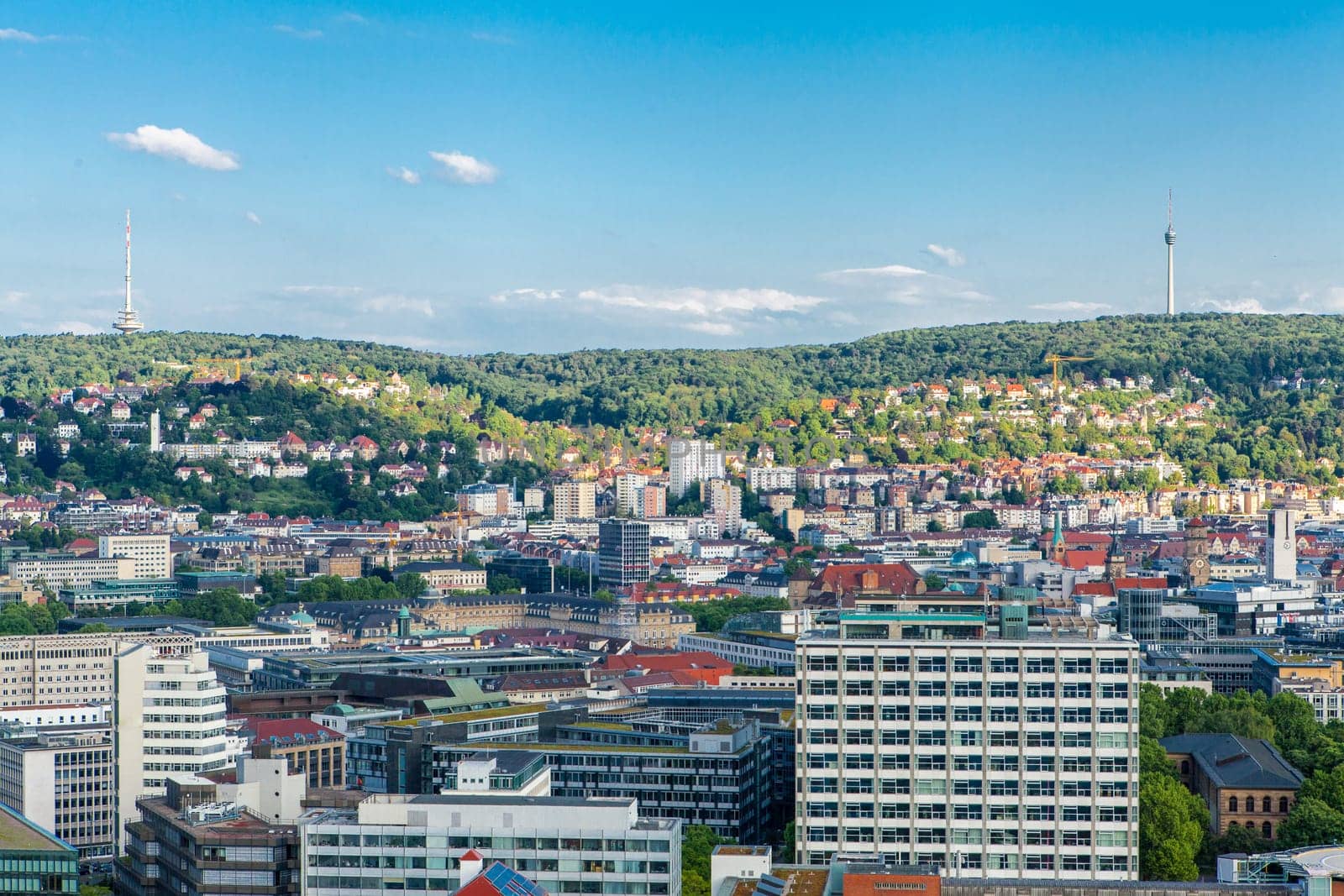 Picturesque view of Stuttgart Germany the modern skyscrapers under the traditional historical architecture overlooking the surrounding hills on a sunny day