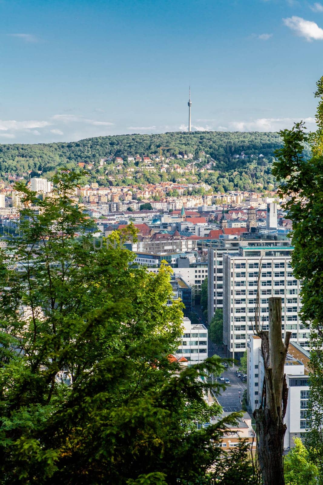Picturesque view of Stuttgart Germany the modern skyscrapers under the traditional historical architecture overlooking the surrounding hills on a sunny day