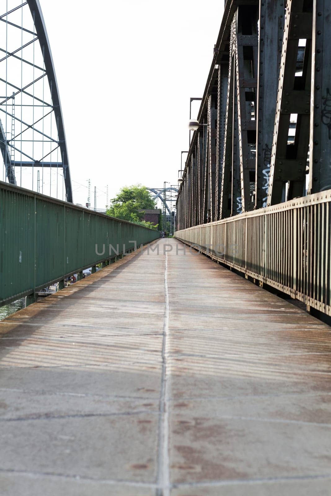 Abandoned bridge with rails for train traffic in daylight