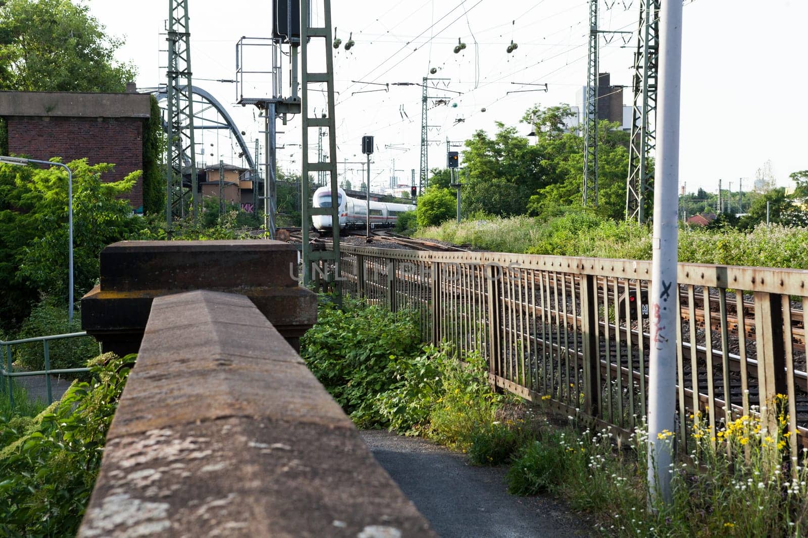 Abandoned bridge with rails for train traffic in daylight