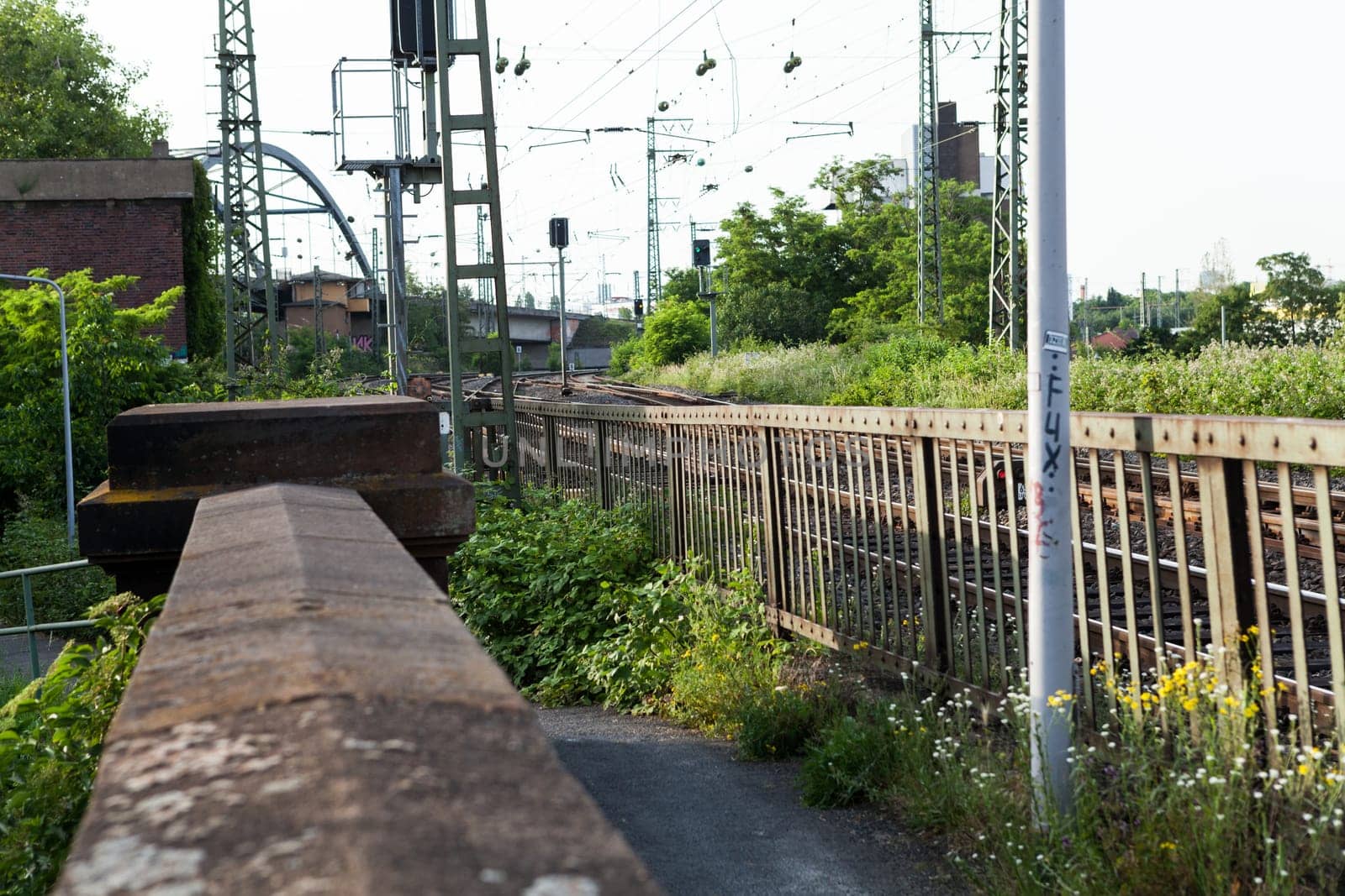 Abandoned bridge with rails for train traffic in daylight